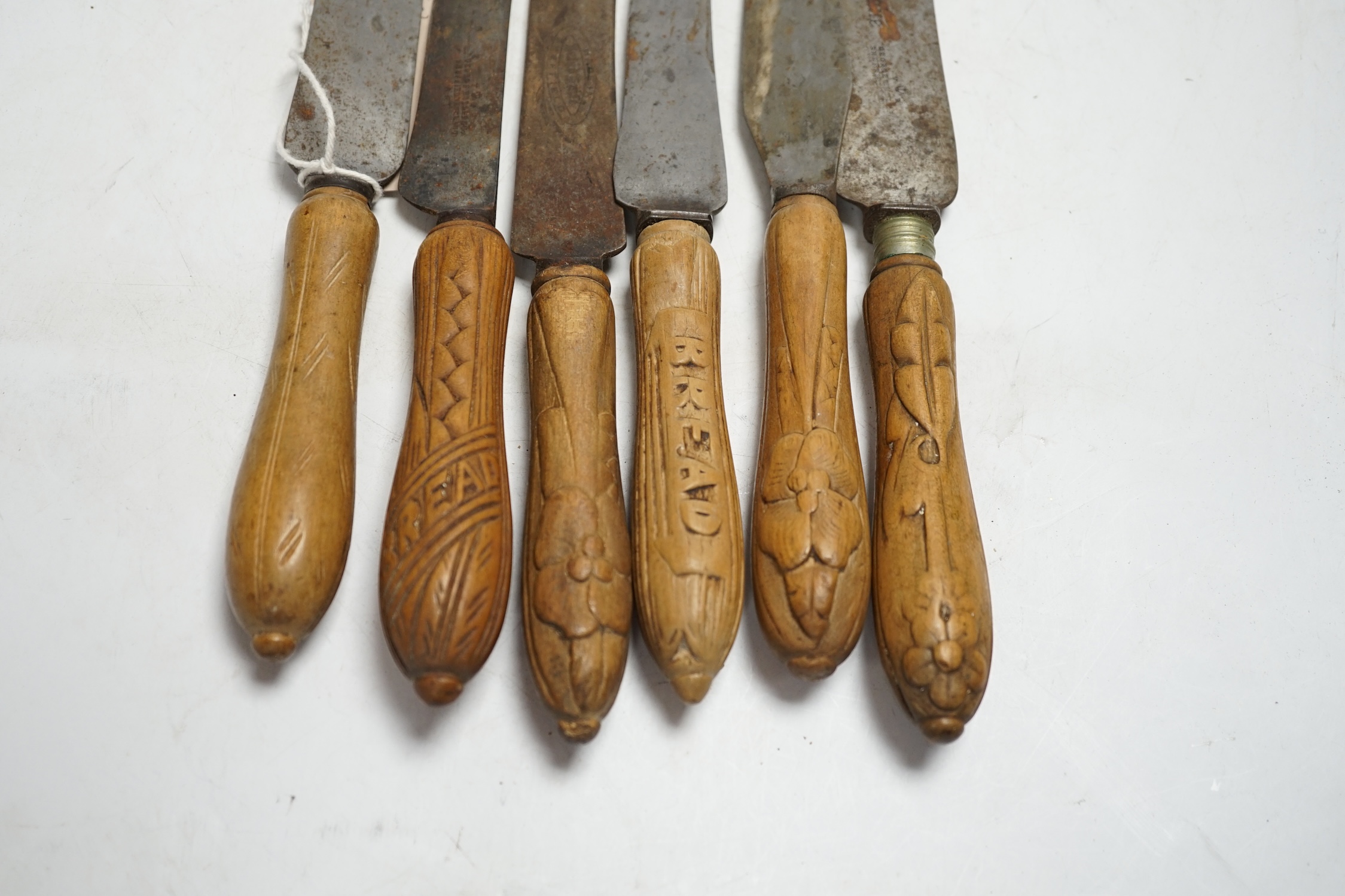 Six Victorian wood handled bread knives, longest 35.5cm